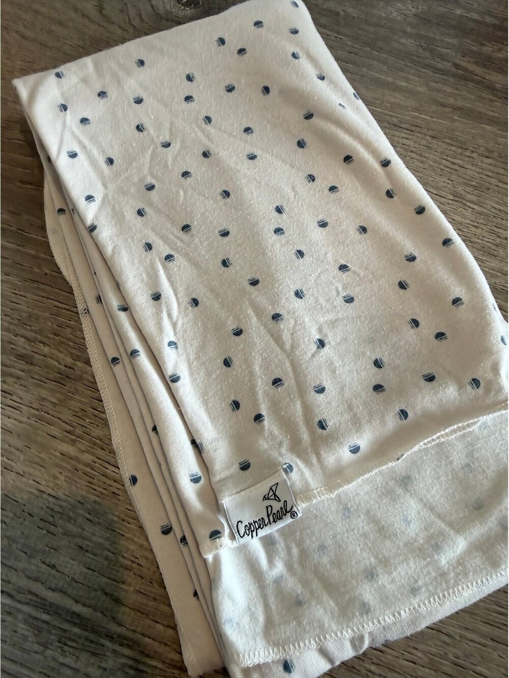 Copper Pearl, cream and tiny blue polka dot baby swaddle